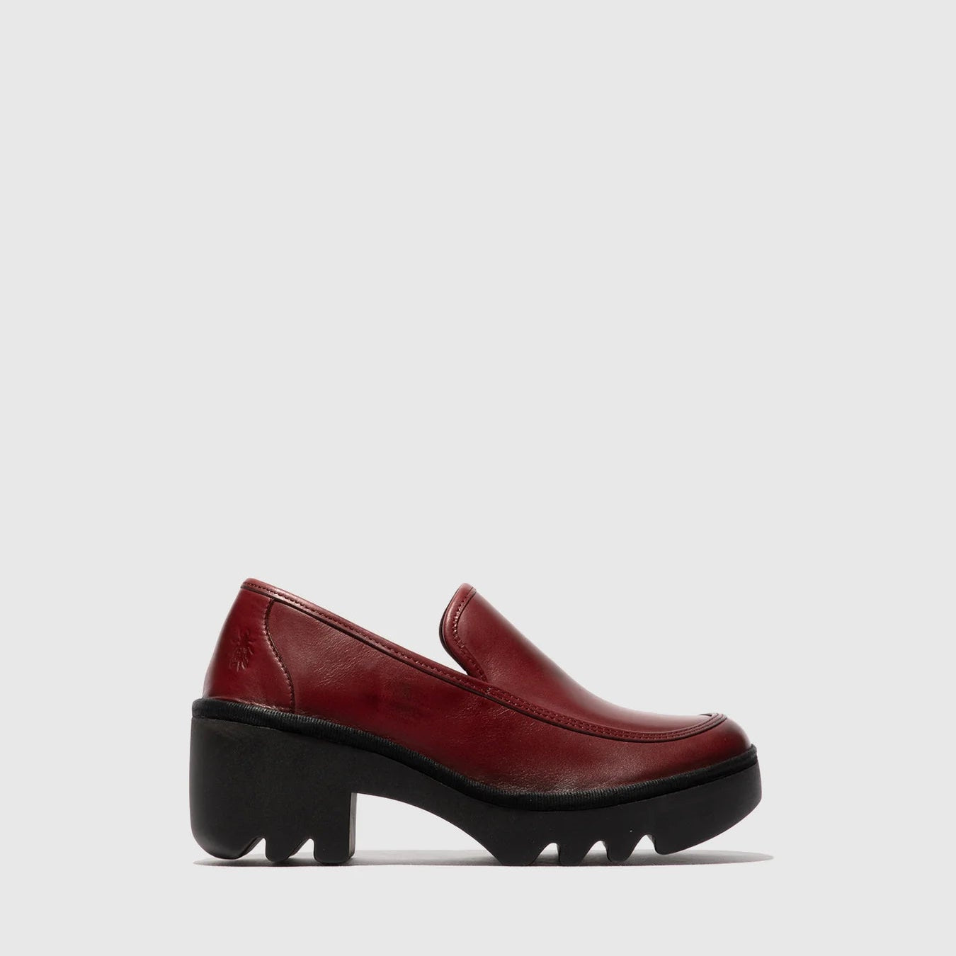 Red loafer shoe on a white background