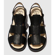 Black wedge sandals on a white background