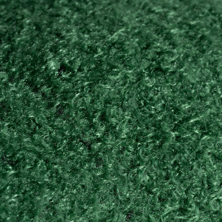 Close-up of dark green textured fabric