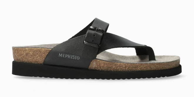 Black sandal with cork sole on a white background