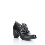 Black leather shoe with buckle details on a white background