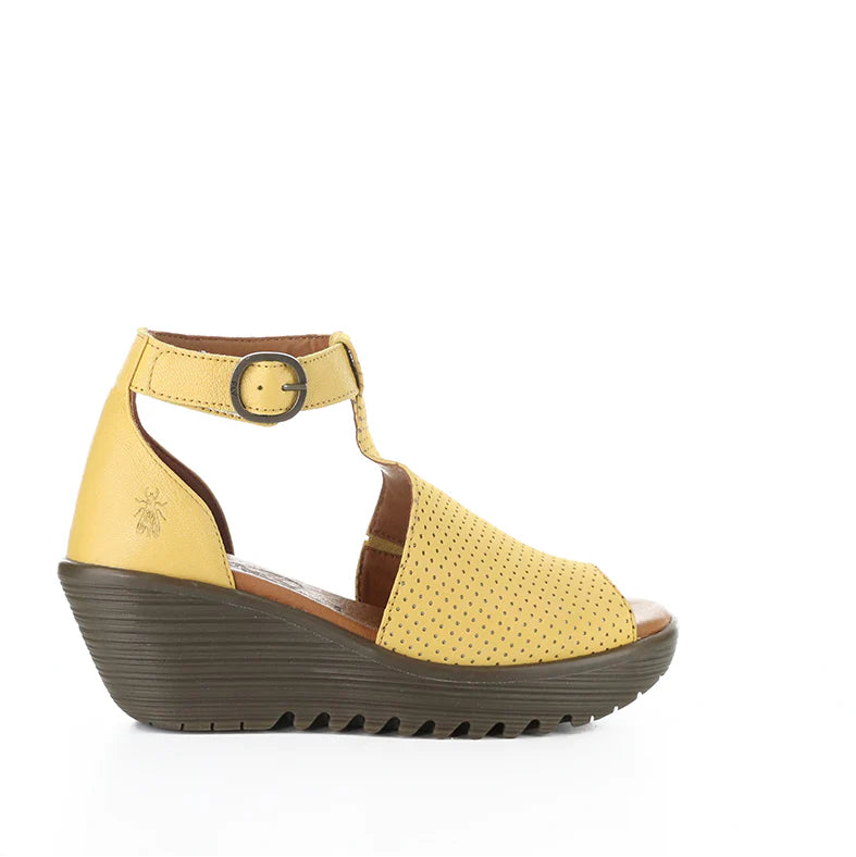 Yellow sandal with brown sole on a white background