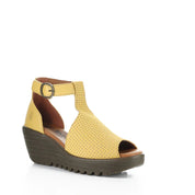 Yellow sandal with brown sole on a white background