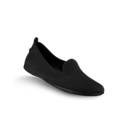 Black slip-on shoe on a white background