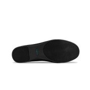 Black shoe sole with Vessi branding on a white background