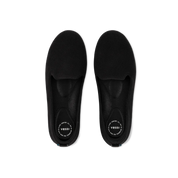Pair of black slippers with 'Vessi' branding on a white background