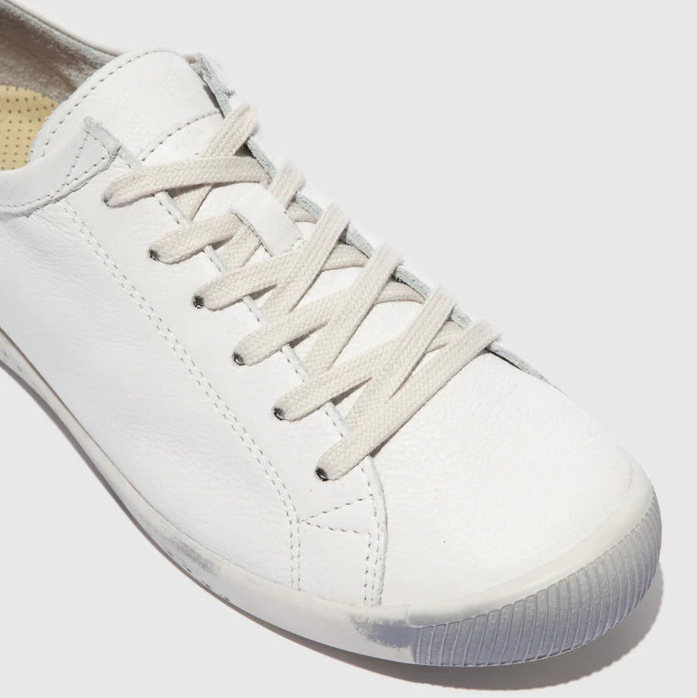 White sneaker with laces on a light gray background
