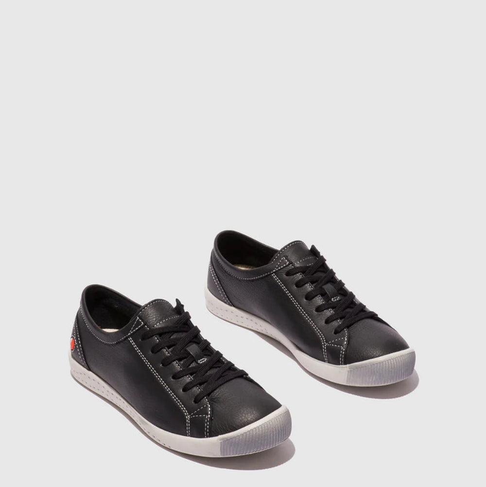 Pair of black sneakers on a light gray background