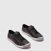 Pair of black sneakers on a light gray background
