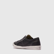 black sneakers on a light gray background