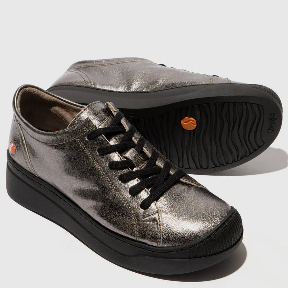 Pair of metallic silver sneakers with black soles on a light gray background