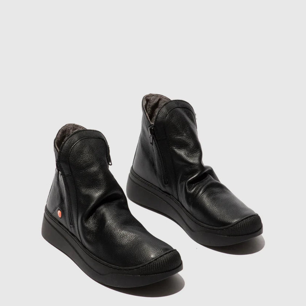 Pair of black leather boots on a white background