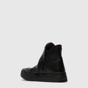 Pair of black ankle leather boots on a white background