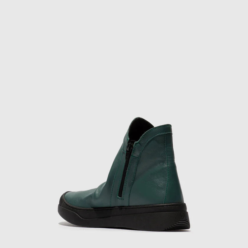 Pair of green zip up ankle boots on a white background