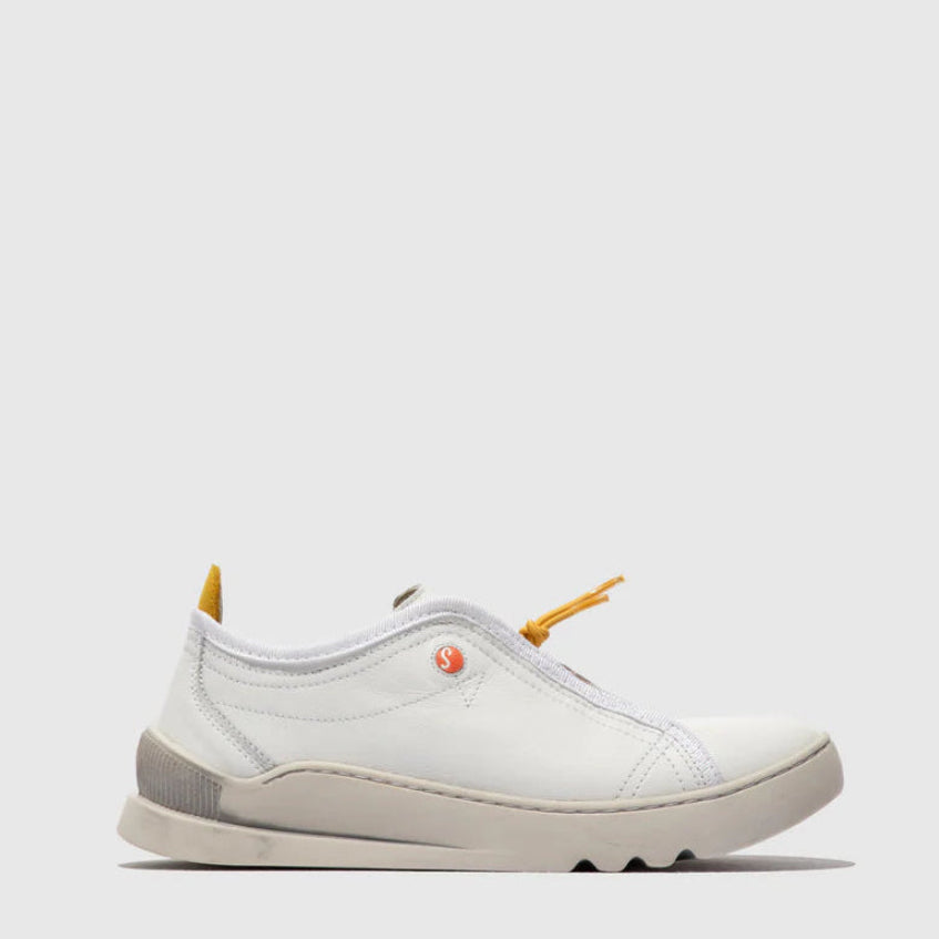 White sneaker with yellow accents on a light gray background