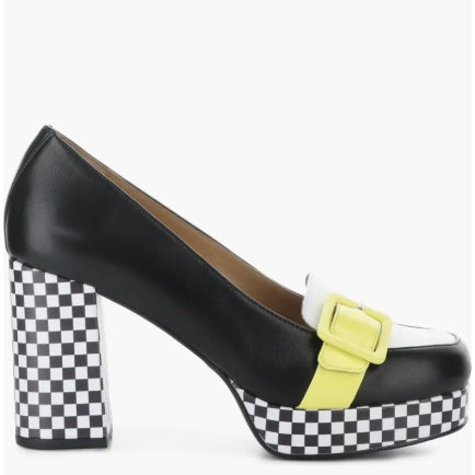 A black leather platform pump with a checkerboard patterned block heel and platform, featuring a white toe cap, a bright yellow strap detail, and a matching yellow buckle.