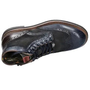 Navy blue leather boot with brown accents on a white background