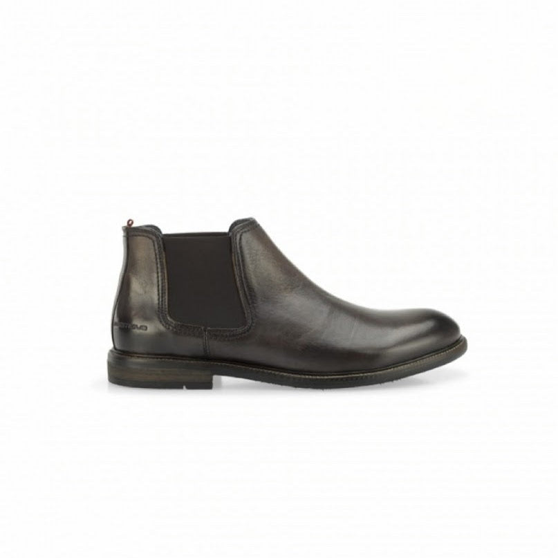 Dark brown leather Chelsea boot on a white background