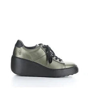 Green sneaker with black sole on a white background