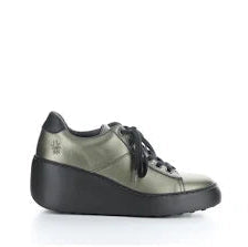 Green sneaker with black sole on a white background