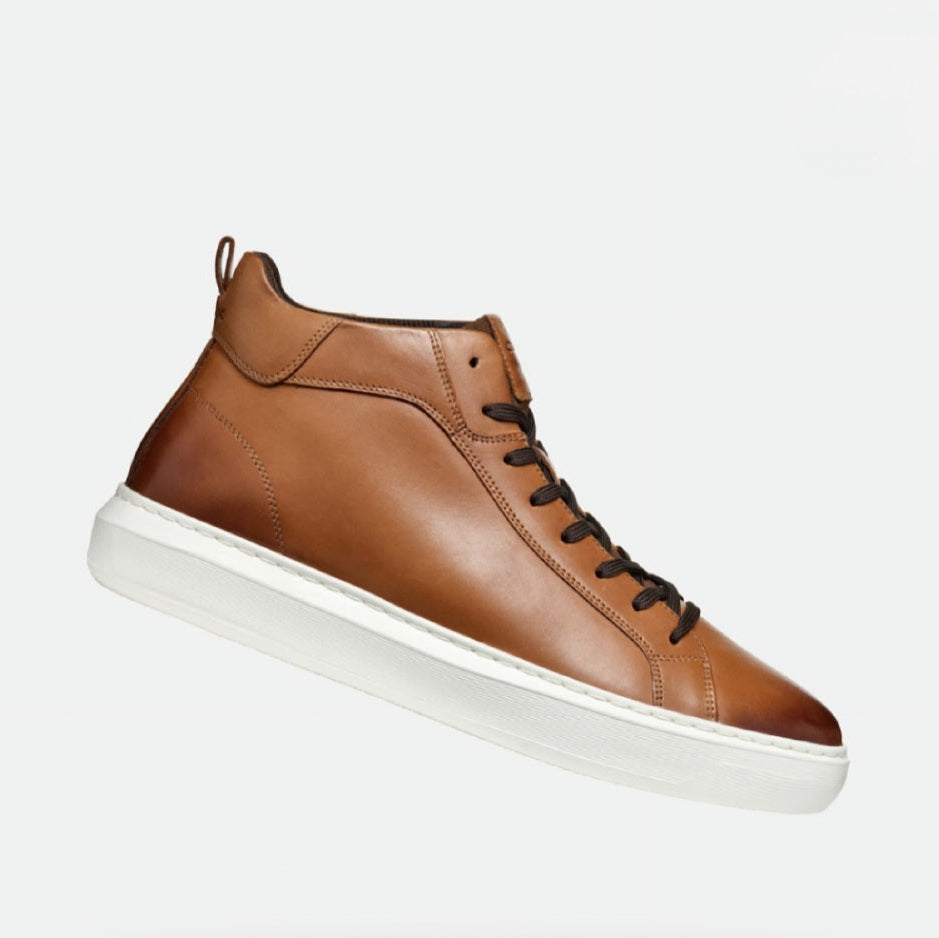 Brown leather high-top sneaker with white sole on a light gray background