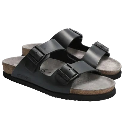 Black sandals with cork soles on a white background