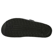 Black sandal sole with tread pattern on a white background