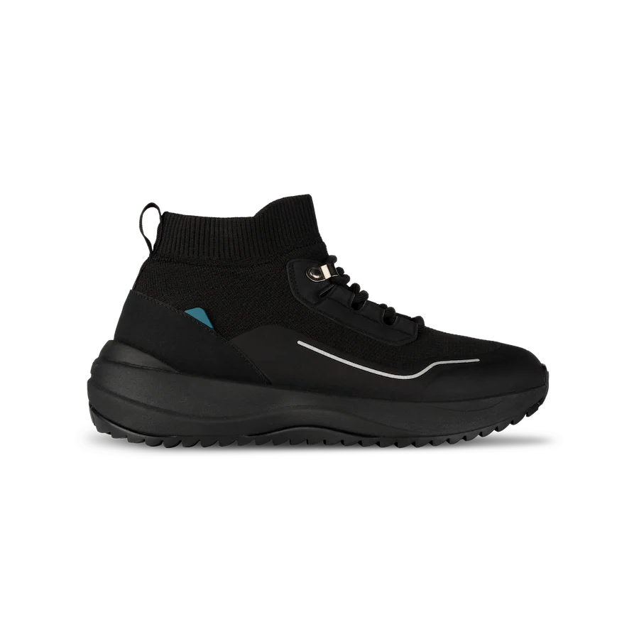 Black sneaker with a thick sole on a white background