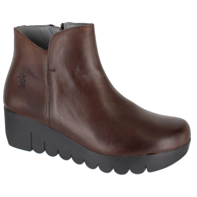 Brown ankle boot with black sole on a white background