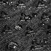 Close-up of textured grey surface with small raised elements