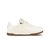 White sneaker with brown sole on a white background