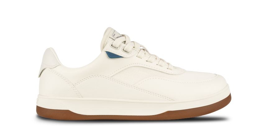 White sneaker with brown sole on a white background