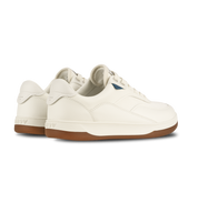 White sneakers with brown soles on a white background