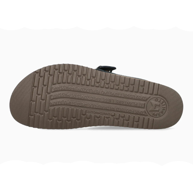 Brown sole of a shoe with tread pattern on a white background