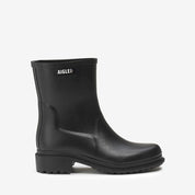 Black rain boot with Aigle logo on a white background