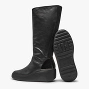 Black knee-high boot with a visible brand logo on a white background