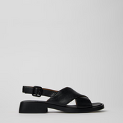 Black sandal on a light gray background