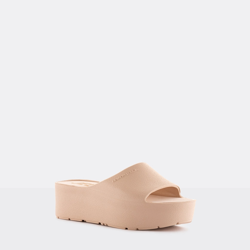 Beige sandal on a light gray background