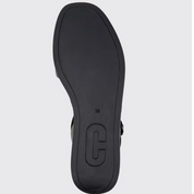 Black sandal sole on a light gray background