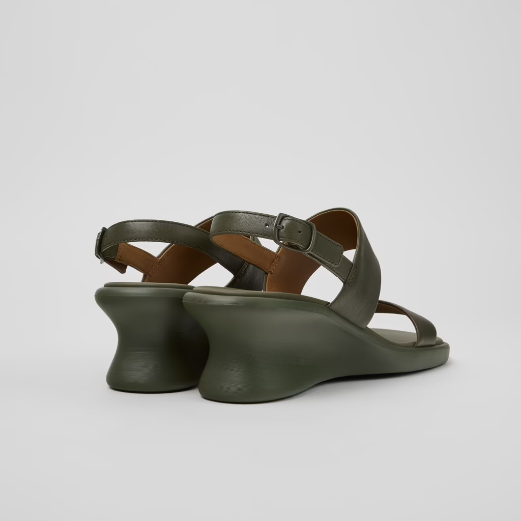 Green wedge sandals on a light gray background
