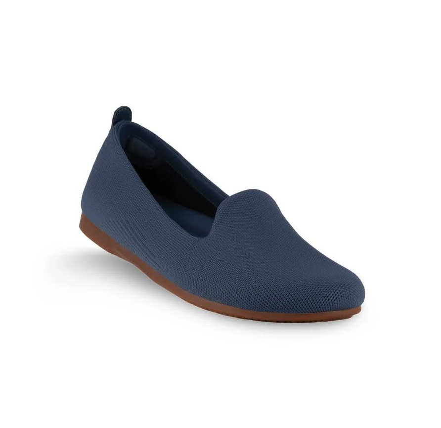 Blue slip-on shoe with rubber sole on a white background
