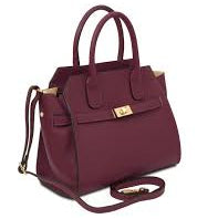 Maroon handbag with gold accents on a white background