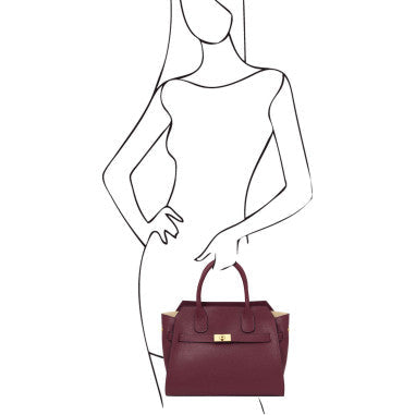 Burgundy handbag held by a stylized woman on a white background