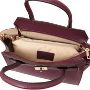 Burgundy handbag with gold zipper on a white background