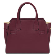 Maroon handbag on a white background