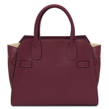 Maroon handbag on a white background
